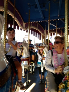 Mette and Grandma Bah riding the carousel.