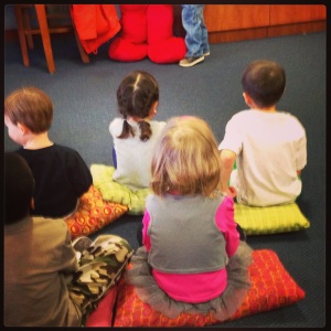 Otto and Mette found matching pillows and chose to sit together downtown for storytime.